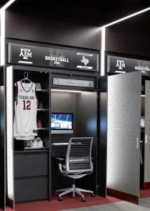 Open athletic nanolam locker, jersey hanging, shelves, and drawers to the left, desk with monitor and chair to the right.